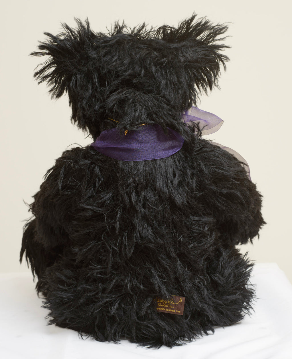 Charlie Bears Indigo - Isabelle Collection - close up of sculpted brown suede-effect paw pad with four-claw stitch detail