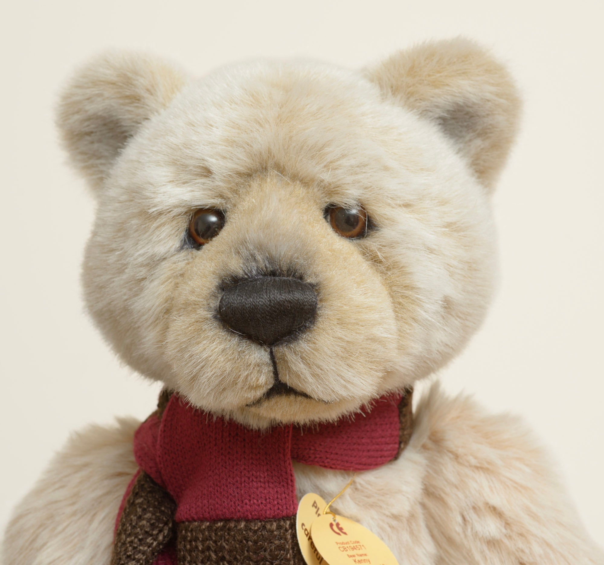 Charlie Bears Kenny - Isabelle Collection - full front view showing sandy-cream plush with rose tint and two-tone knitted scarf