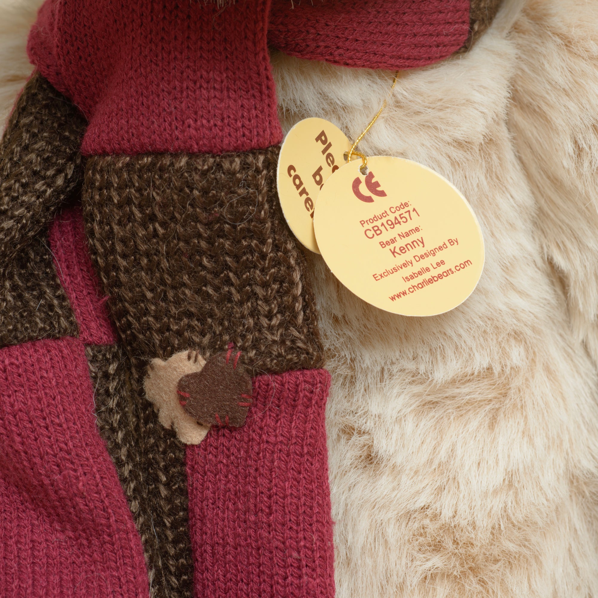 Charlie Bears Kenny - Isabelle Collection - close up of large cream suede-effect paw pads with individual toe and black claw stitching
