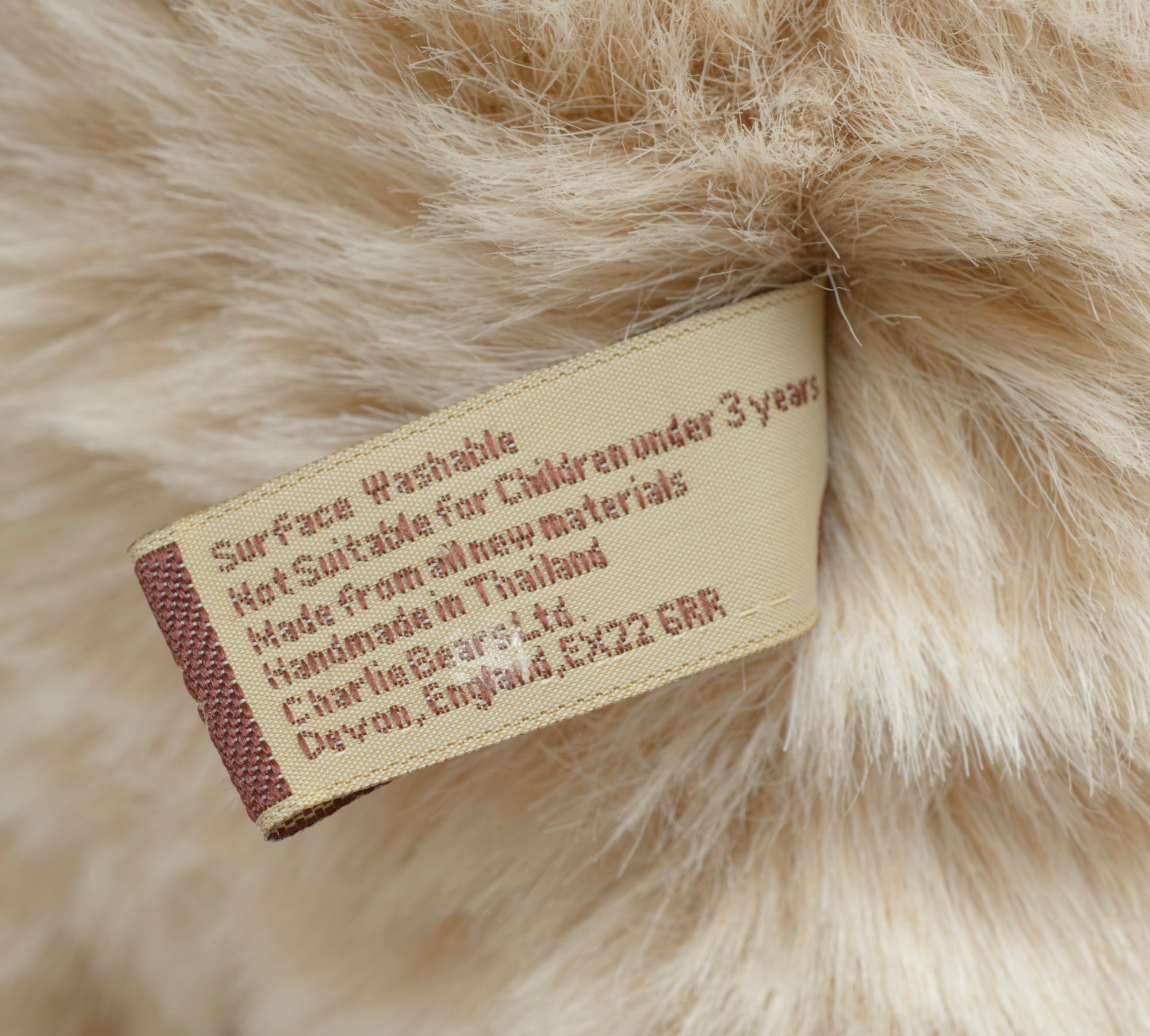Charlie Bears Kenny - Isabelle Collection - swing tag showing product code CB194571, bear name Kenny, exclusively designed by Isabelle Lee