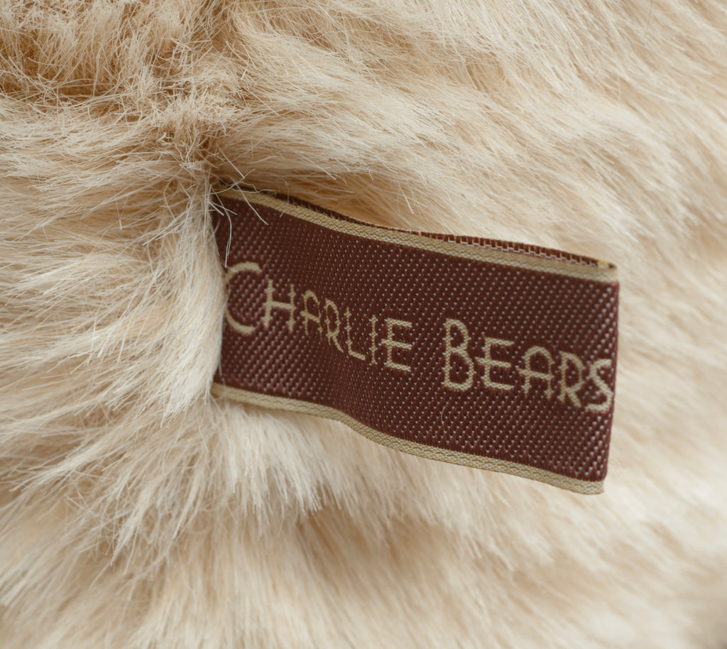 Charlie Bears Kenny - Isabelle Collection - detail of knitted scarf charm showing small knitted bear in burgundy and brown