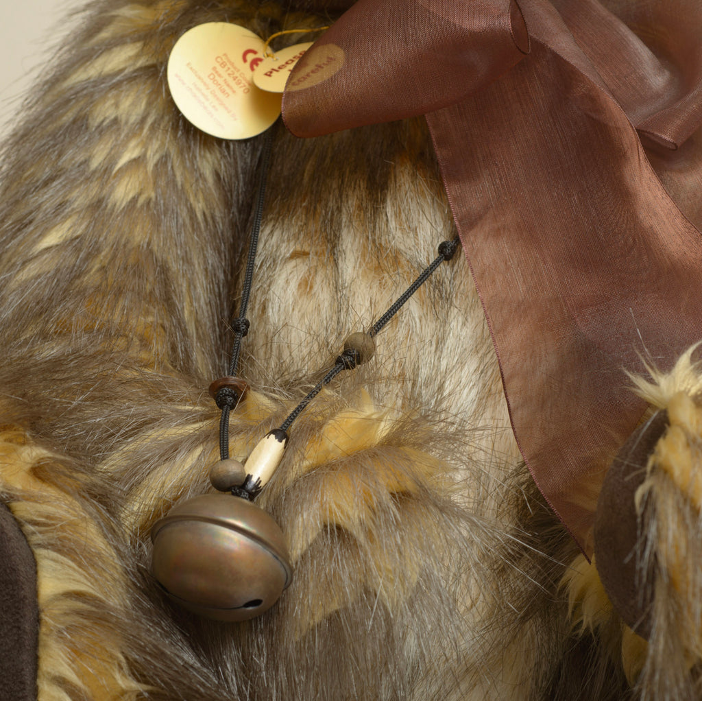 Charlie Bears Dorian - Isabelle Collection - full front view showing wild shaggy tipped sandy-gold and dark brown plush coat with brown organza bow