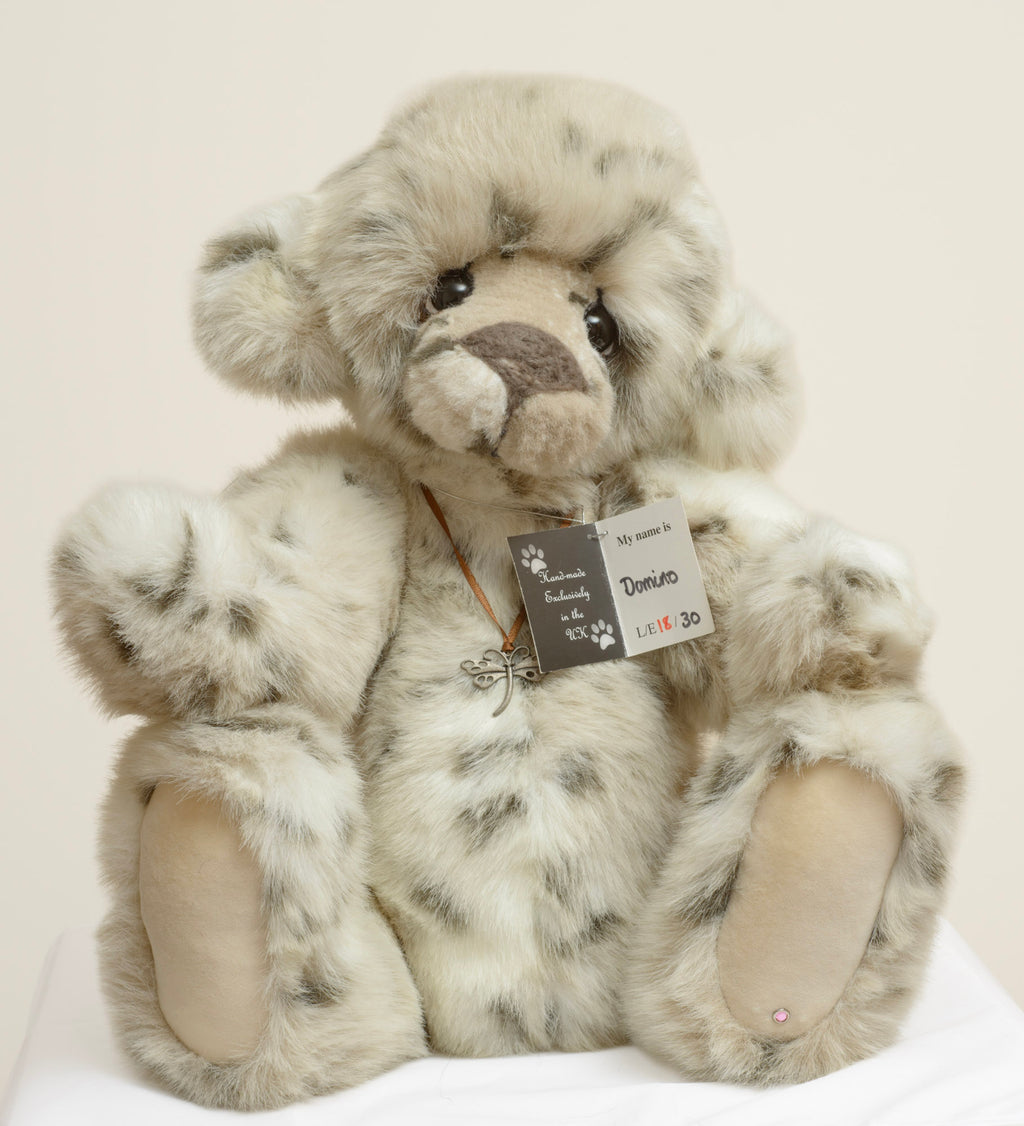 Kaycee Bears Domino - Kelsey Cunningham - full front view showing dappled cream and grey plush coat with copper organza ribbon and dragonfly pendant