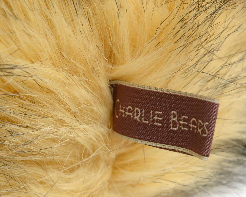 Charlie Bears Lincoln - Isabelle Collection - collar detail showing brown suede effect collar with five silver tone jingle bells on gold cord