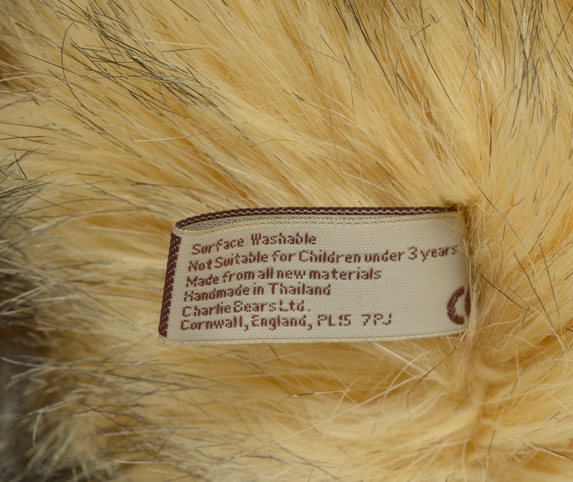 Charlie Bears Lincoln - Isabelle Collection - full front view showing tipped sandy gold and grey plush coat with five-bell suede collar