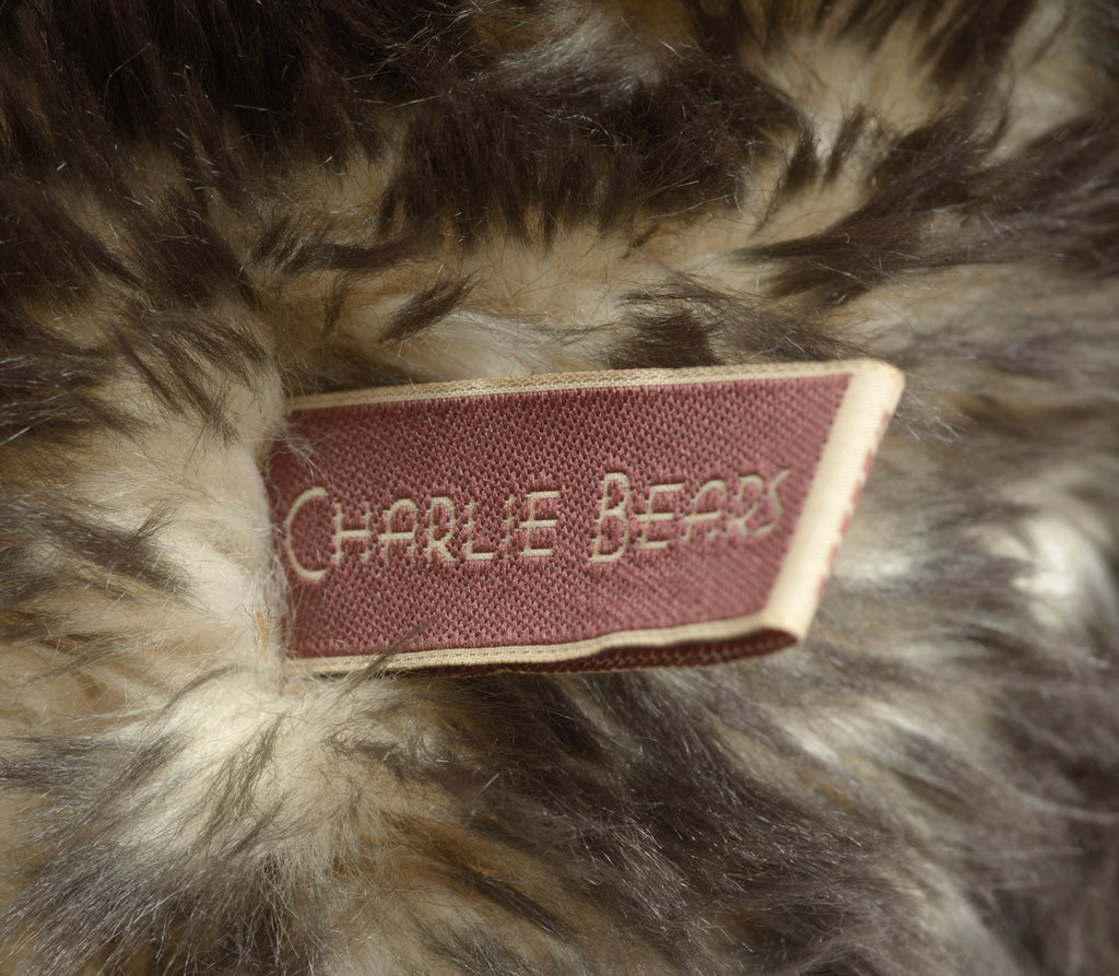 Charlie Bears Breeny - Isabelle Collection - upper body and face showing swing tag, jute necklace with wooden beads and aged copper bell