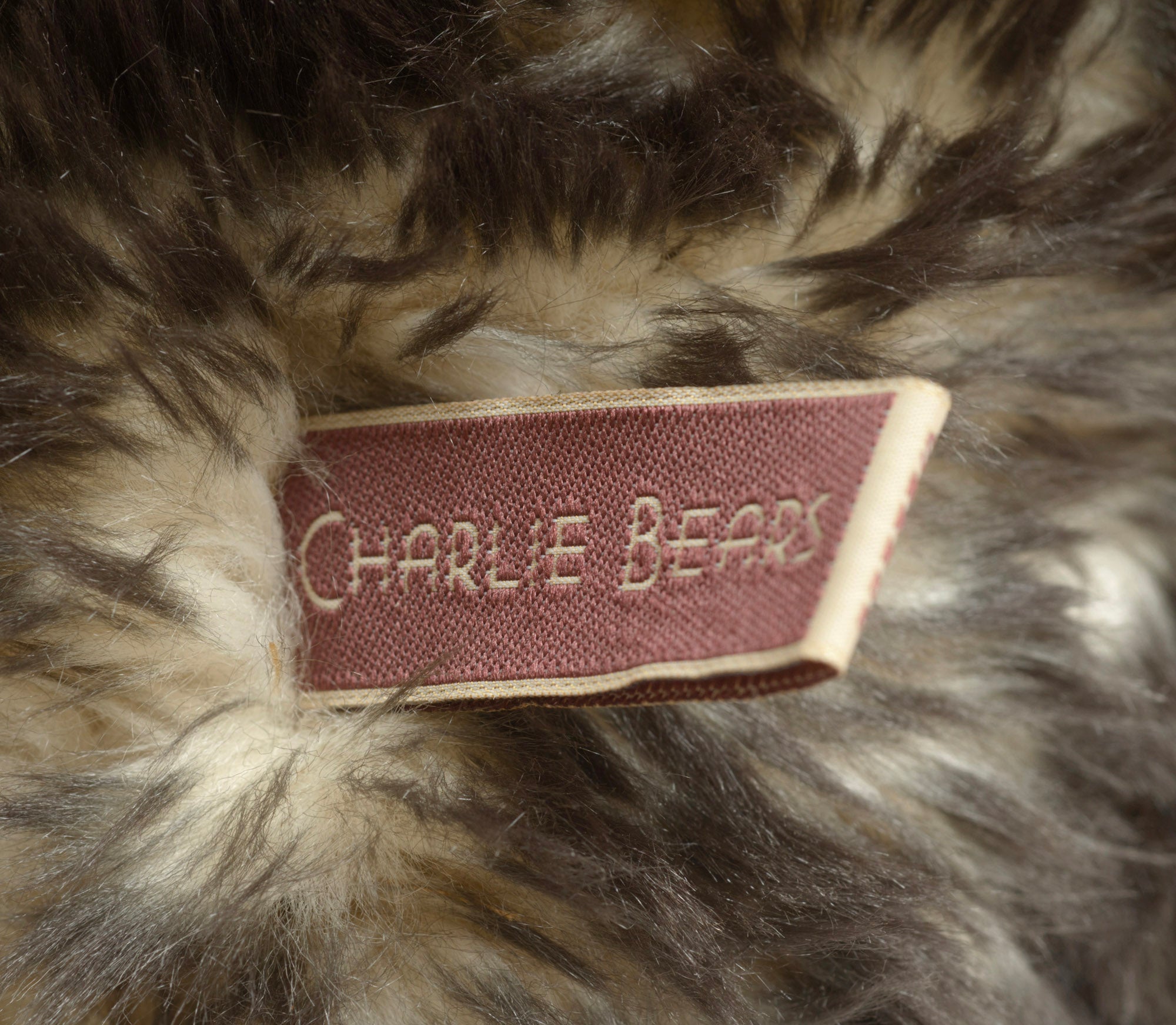 Charlie Bears Breeny - Isabelle Collection - upper body and face showing swing tag, jute necklace with wooden beads and aged copper bell