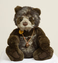 Charlie Bears Breeny - Isabelle Collection - necklace detail showing twisted jute rope with dark wooden beads, silver tone feather charm and copper bell