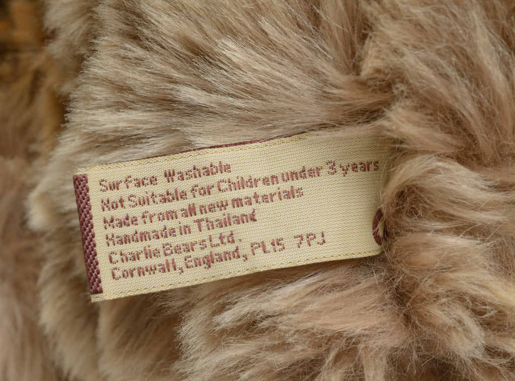Charlie Bears William III - full front view showing sandy taupe tipped plush coat with wide brown organza ribbon bow at neck