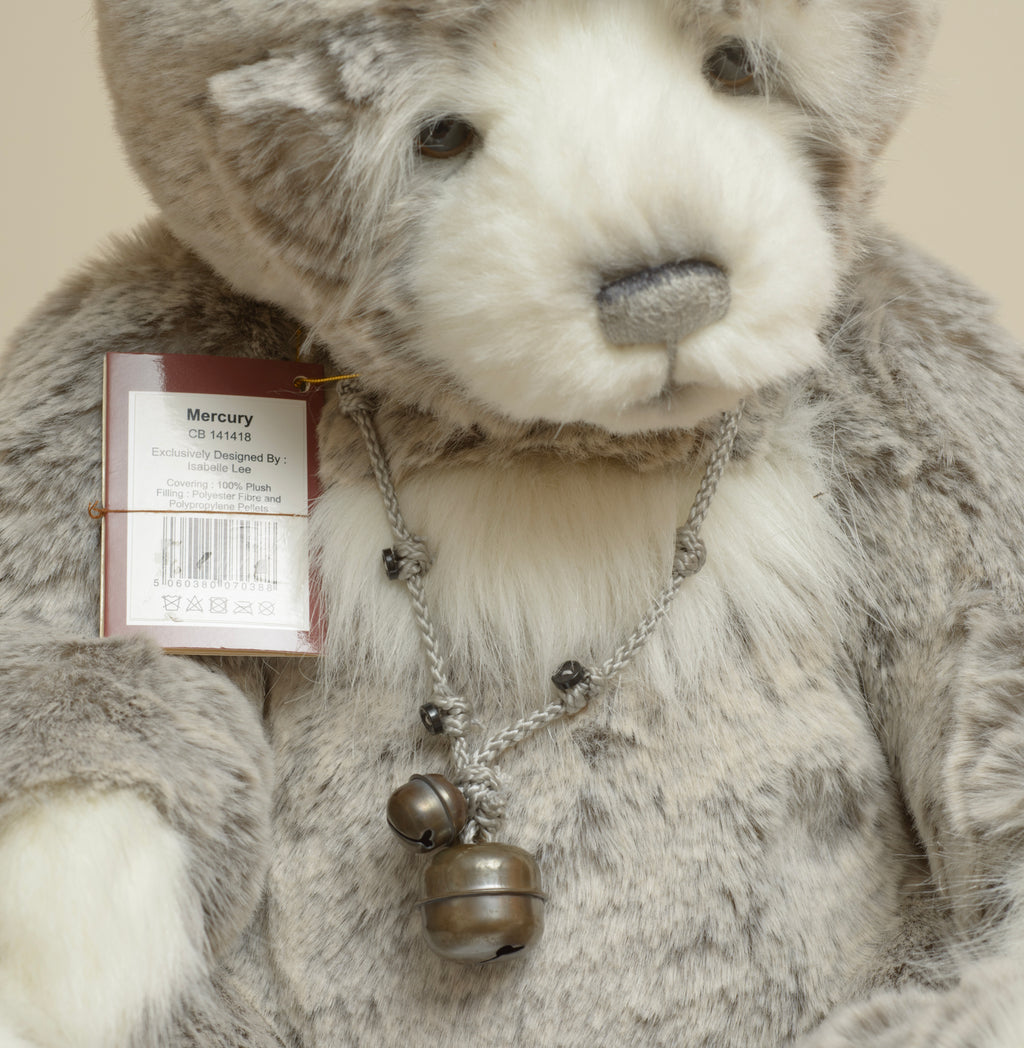 Charlie Bears Mercury - Isabelle Collection - necklace detail showing twisted grey cord with small decorative dark buttons and two aged silver tone bells
