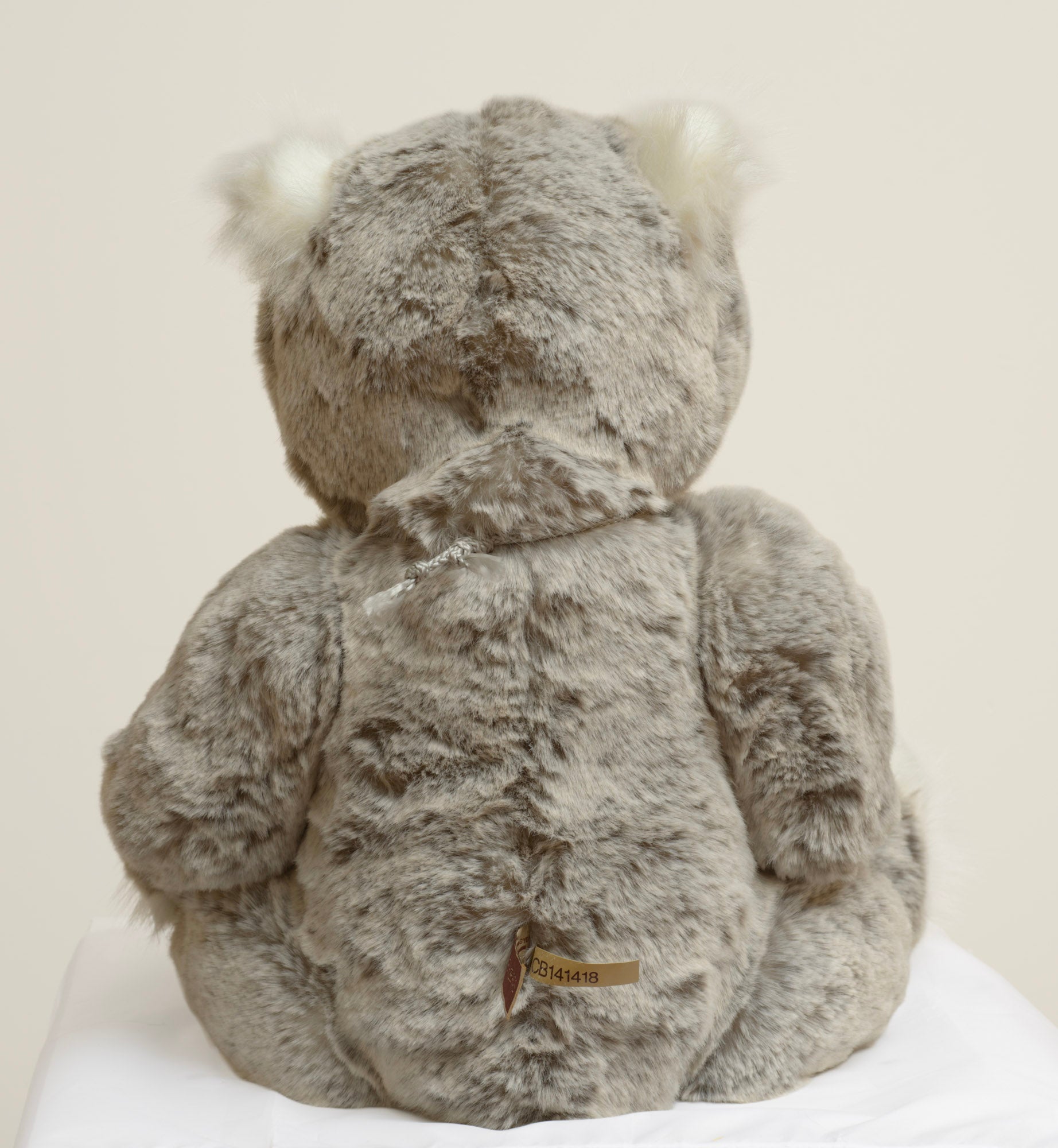 Charlie Bears Mercury - Isabelle Collection - rear view showing dappled grey tipped plush coat and Charlie Bears woven label with CB141418 fabric strip
