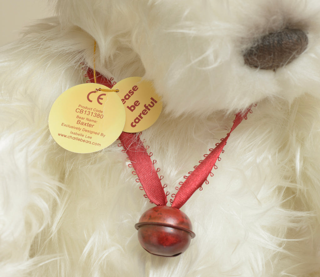 Charlie Bears Baxter - Isabelle Collection - full front seated view showing long white plush coat with red ribbon and single dark red bell