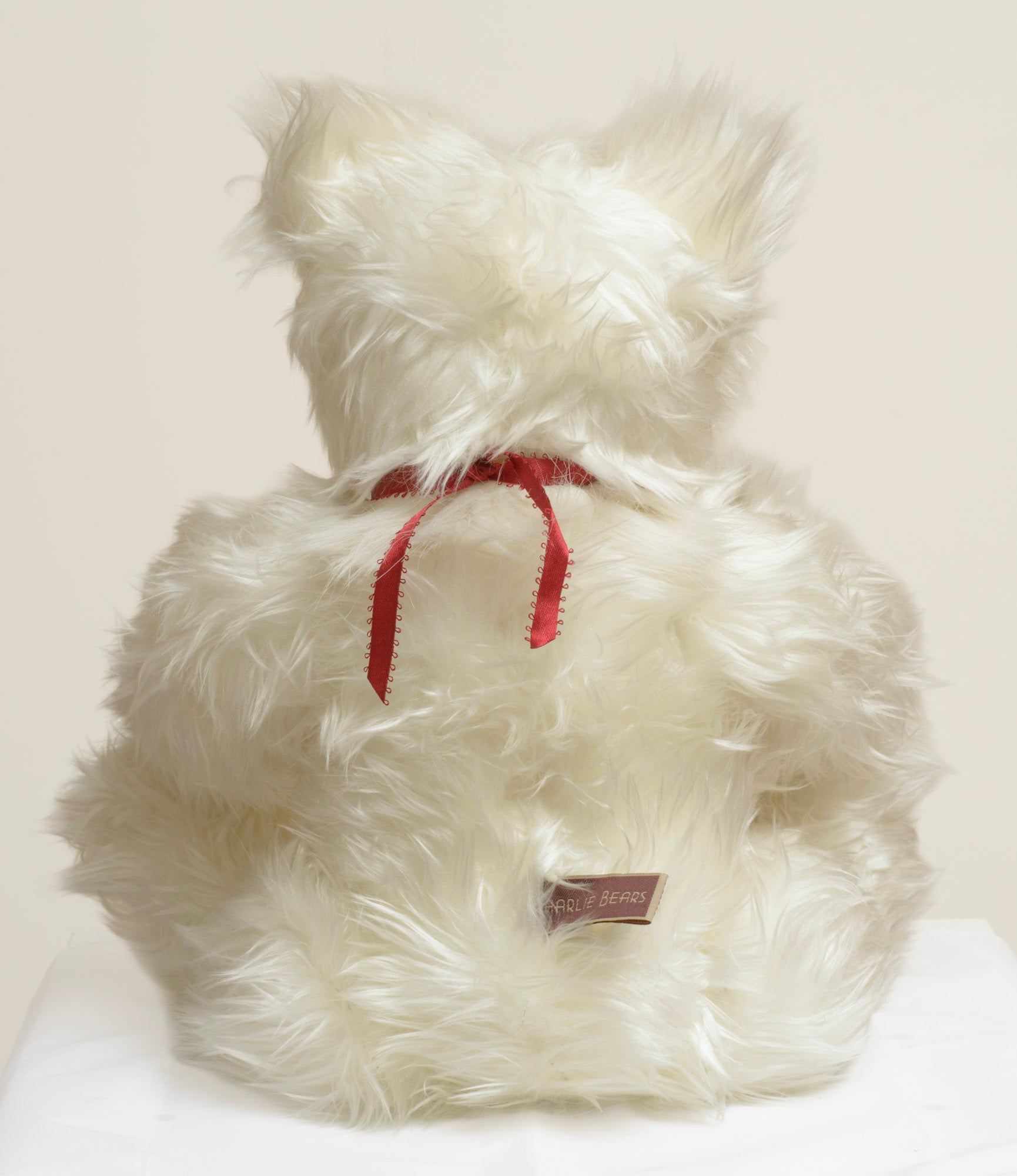 Charlie Bears Baxter - Isabelle Collection - Charlie Bears woven label in cream text on dark plum background sewn to lower back