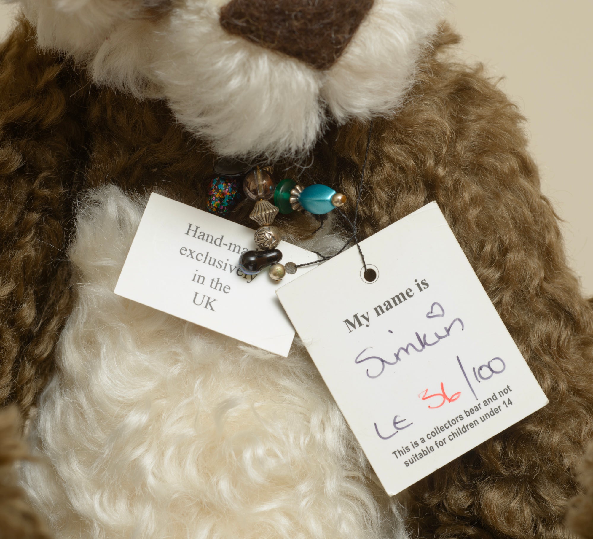 Kaycee Bears Simkin - Kelsey Cunningham - AN ORIGINAL Kaycee woven label in gold text on dark brown background sewn to tummy panel