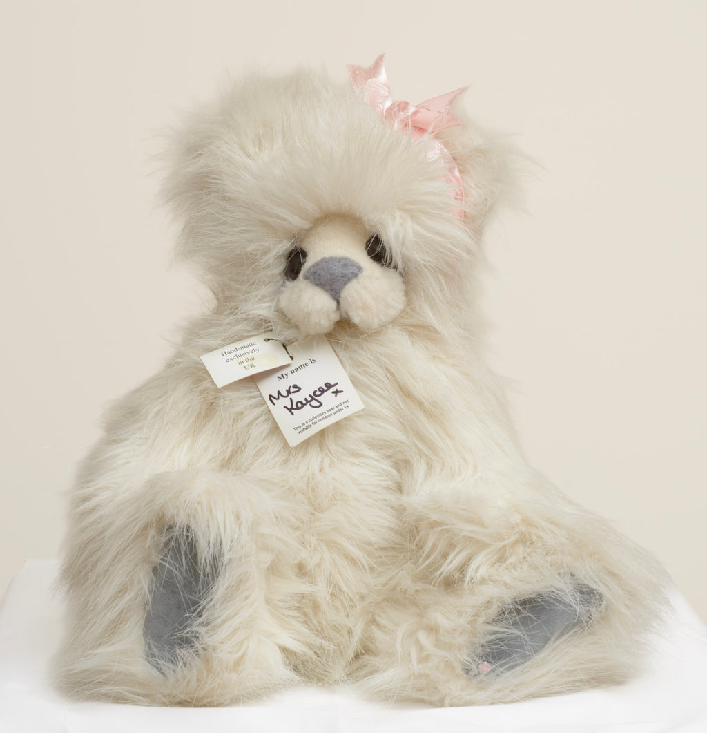 Kaycee Bears Mrs Kaycee - Kelsey Cunningham - pink satin bow detail showing deliberately frayed edges set to one side of head in pale dusty pink