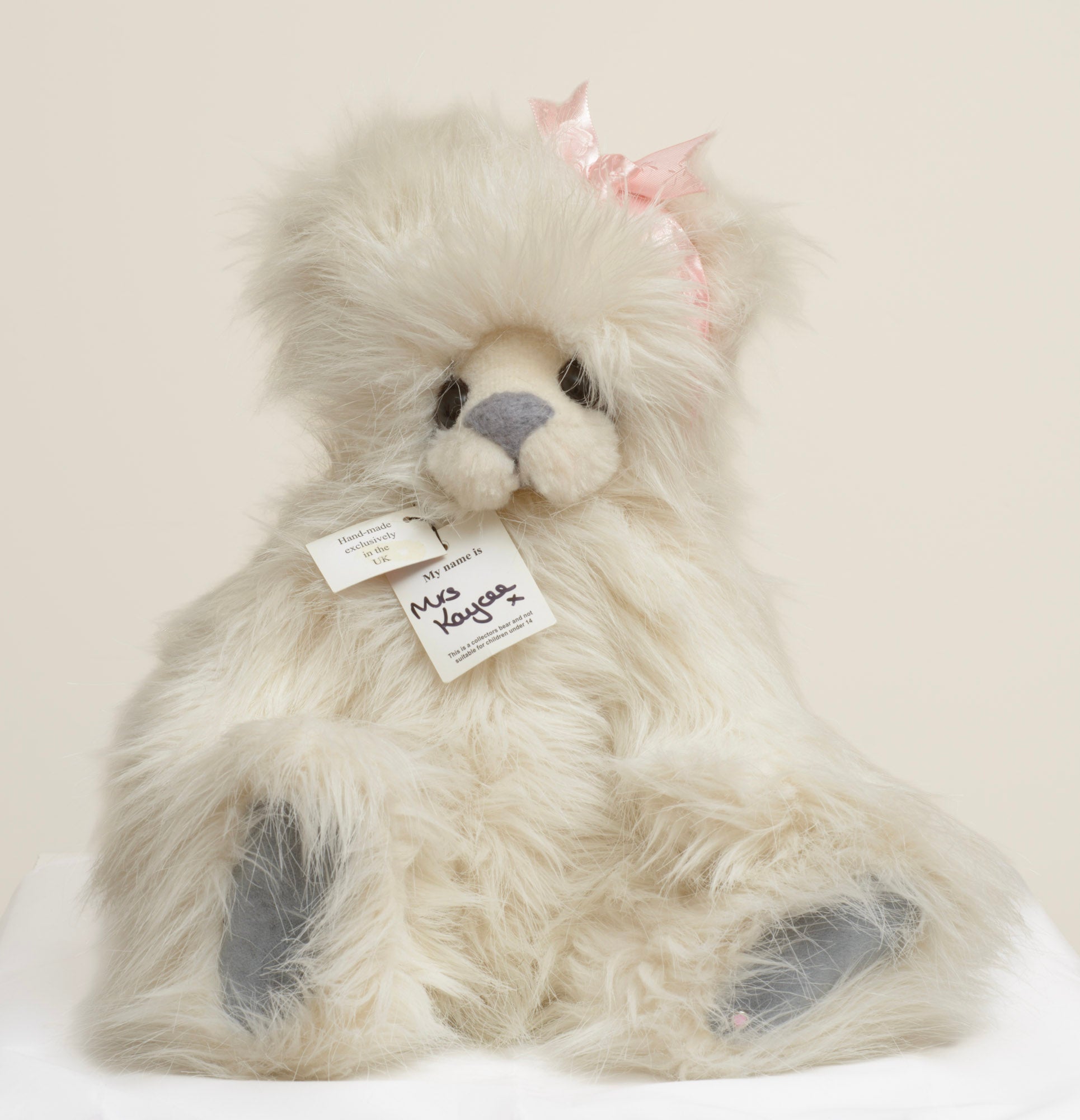 Kaycee Bears Mrs Kaycee - Kelsey Cunningham - pink satin bow detail showing deliberately frayed edges set to one side of head in pale dusty pink