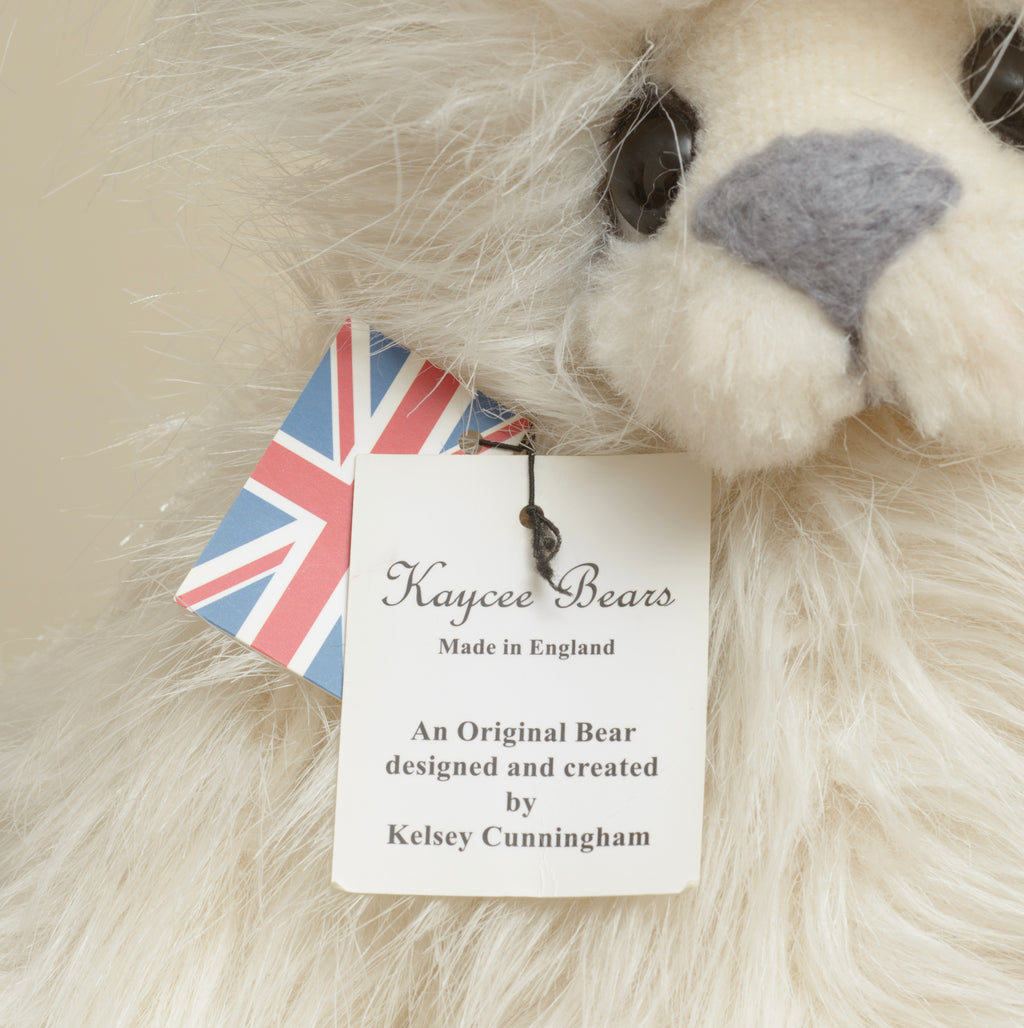 Kaycee Bears Mrs Kaycee - Kelsey Cunningham - paw pad detail showing large plain grey suede effect pad against long cream ivory plush
