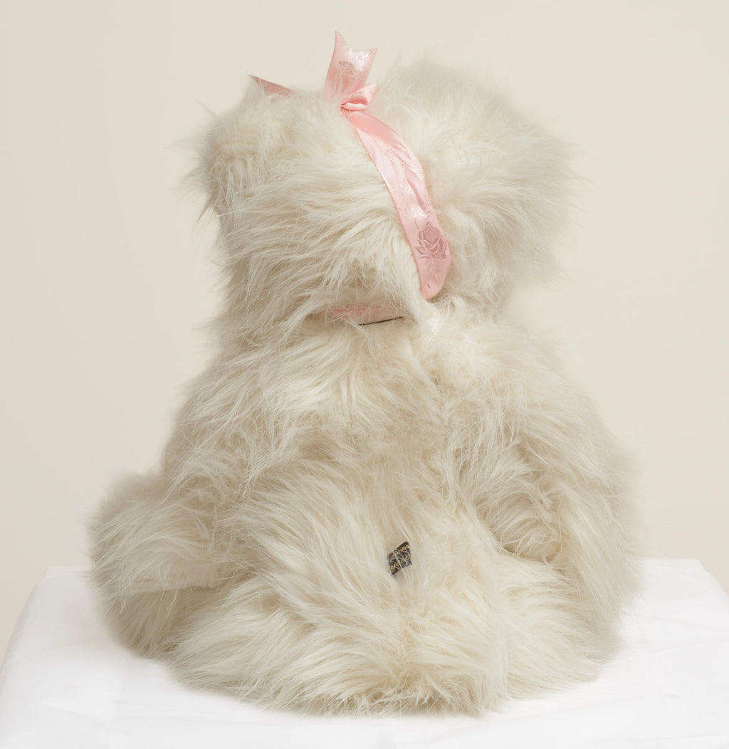 Kaycee Bears Mrs Kaycee - Kelsey Cunningham - three-quarter view showing full coat texture of long feathered cream ivory plush with natural movement