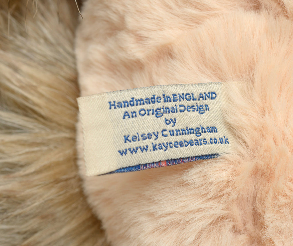 Kaycee Bears Hugglesome - Kelsey Cunningham - face detail showing blush pink curly plush muzzle area against long sandy taupe coat with dark glass eyes and broad dark chocolate felt nose