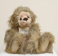 Kaycee Bears Hugglesome - Kelsey Cunningham - close up face showing long wild sandy taupe plush, blush pink muzzle area, dark glass eyes and large dark chocolate brown felt nose