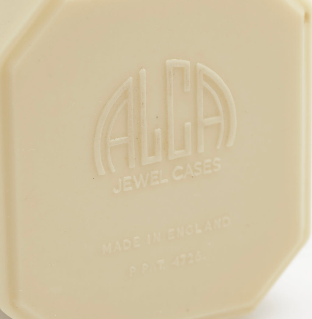 Art Deco ALCA Bakelite ring box - cream - three-quarter open view showing contrast between pale cream Bakelite exterior and dark black flock interior