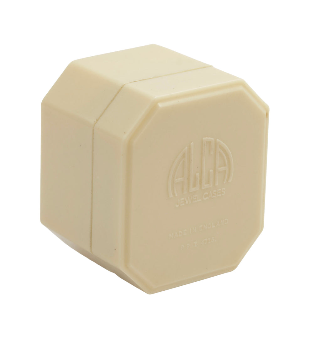 Art Deco ALCA Bakelite ring box - cream - front view closed showing faceted octagonal stepped lid form on grey background