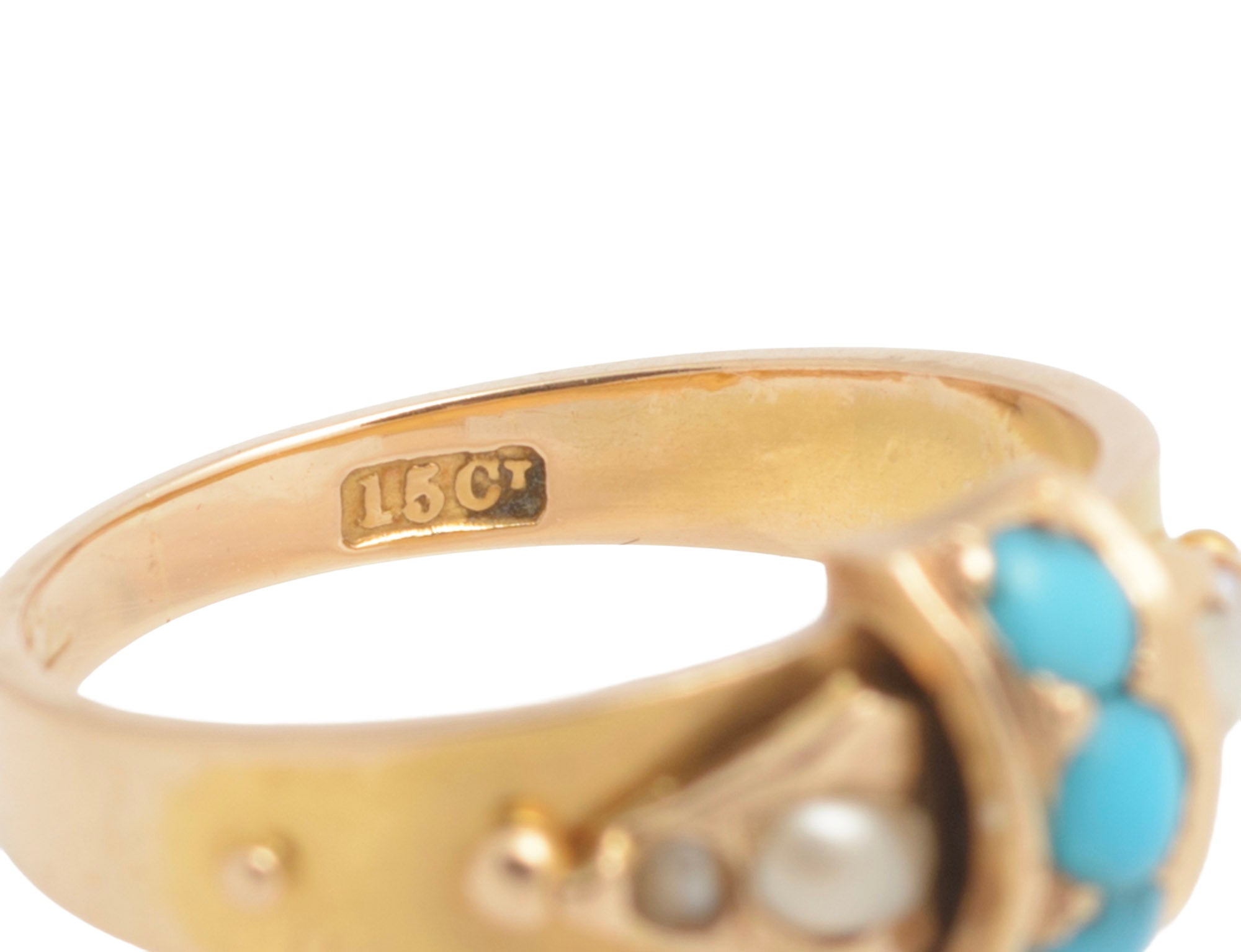 Victorian 15ct gold ring - natural turquoise and split pearls - angled view on ring stand showing strapwork head profile and solid gold band with bead shoulder detail