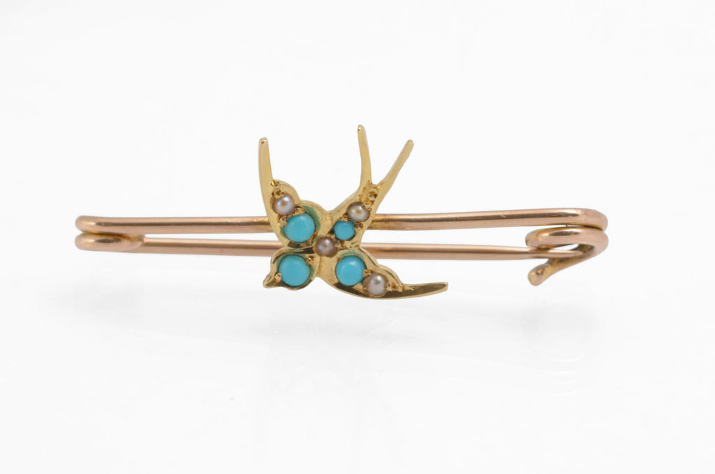Victorian 15ct gold swallow brooch - natural turquoise and split pearls - full length view on double bar rose gold safety pin showing complete brooch with forked tail swallow and scroll pin ends