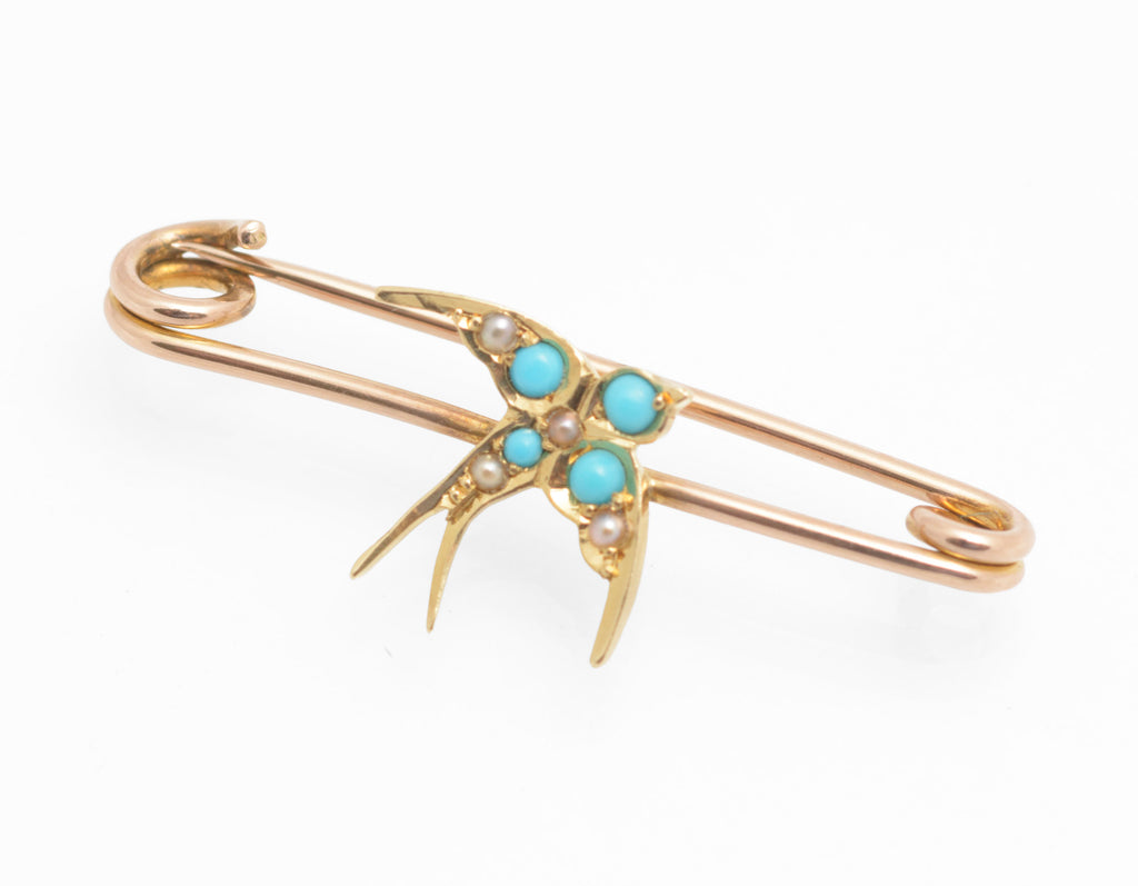 Victorian 15ct gold swallow brooch - natural turquoise and split pearls - three-quarter view on 9ct rose gold safety pin fitting showing swallow in flight with forked tail