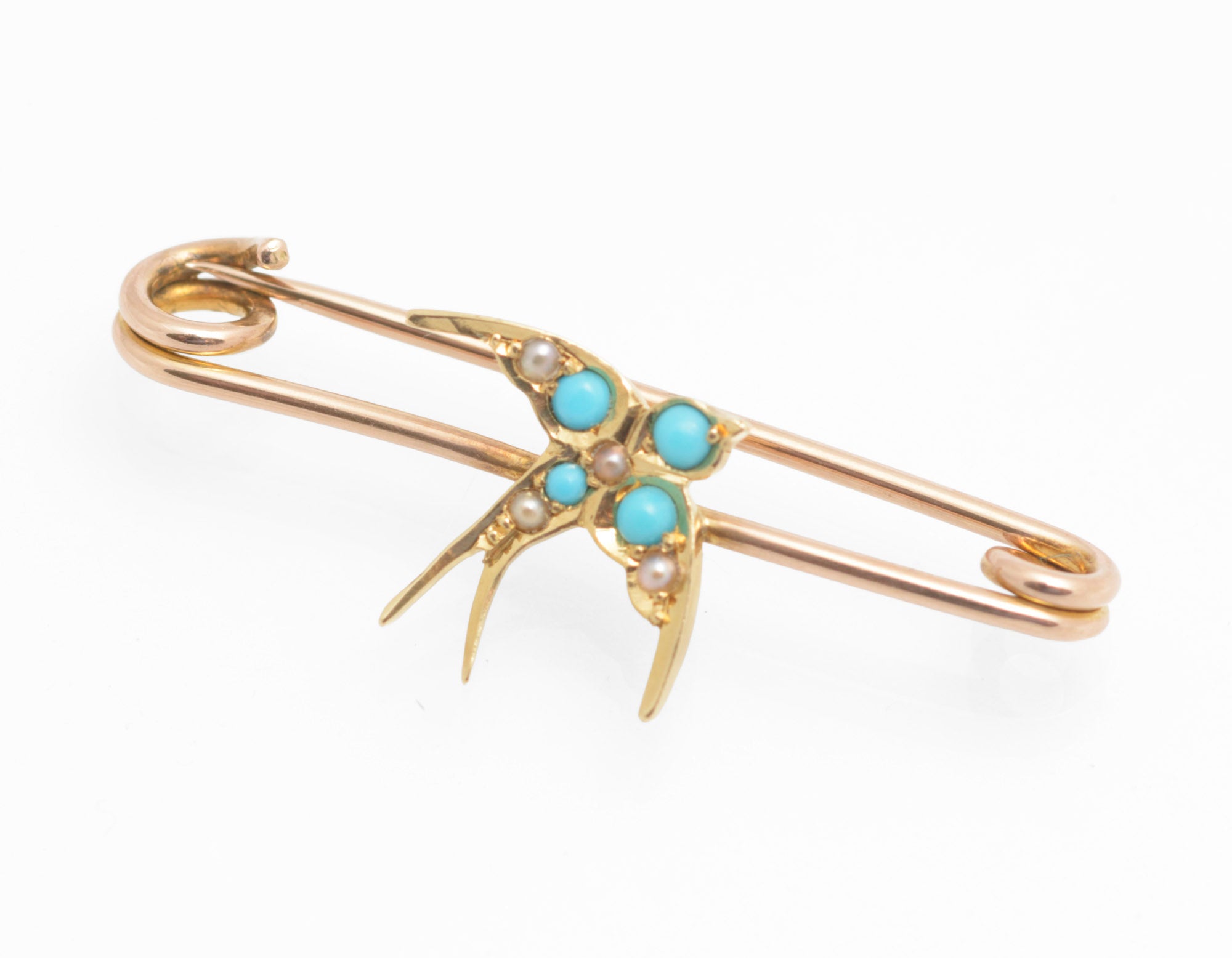 Victorian 15ct gold swallow brooch - natural turquoise and split pearls - three-quarter view on 9ct rose gold safety pin fitting showing swallow in flight with forked tail
