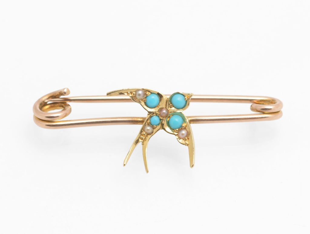 Victorian 15ct gold swallow brooch - natural turquoise and split pearls - close up three-quarter view showing four turquoise cabochons and five split pearls set across wings and breast