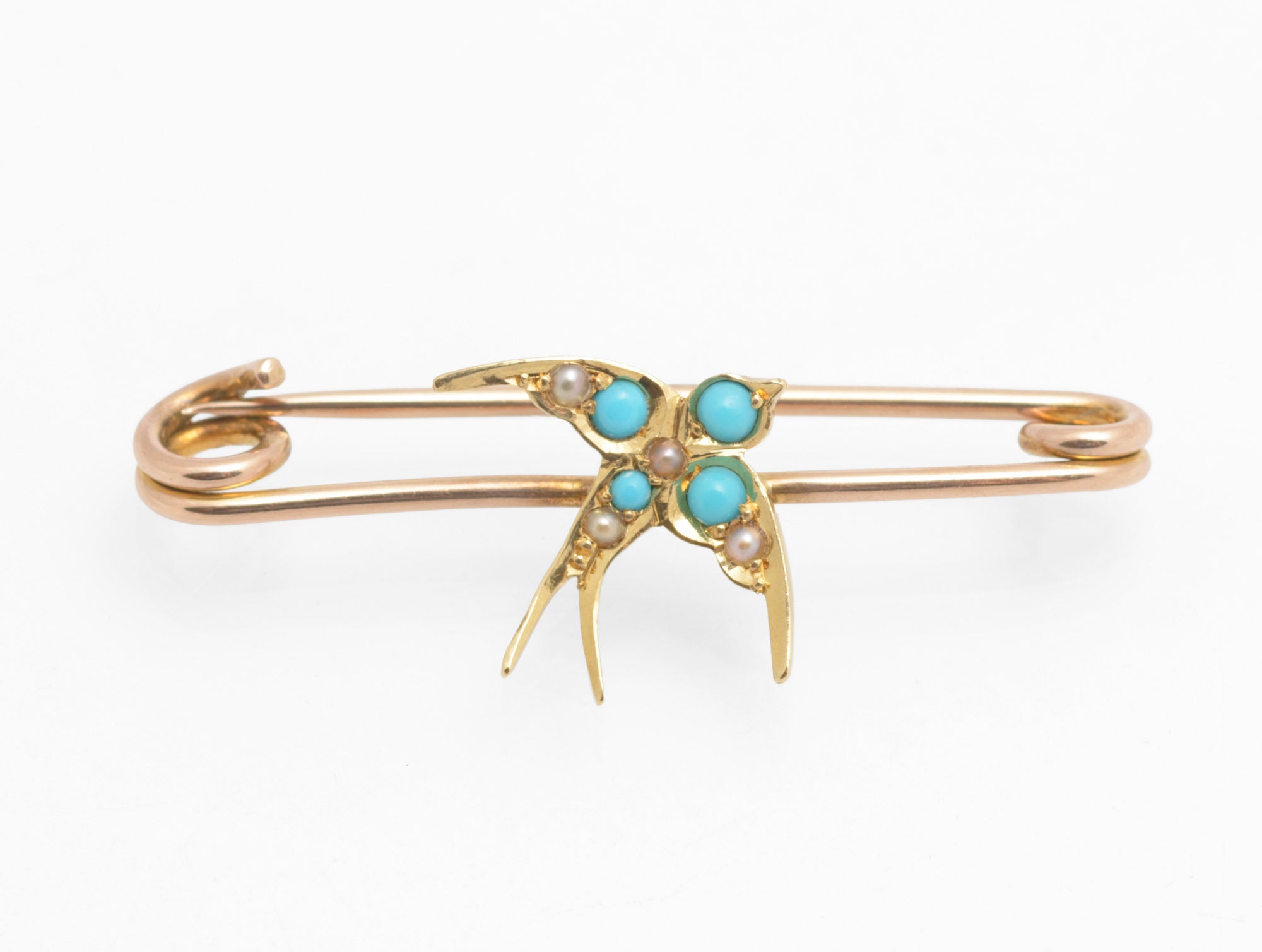 Victorian 15ct gold swallow brooch - natural turquoise and split pearls - close up three-quarter view showing four turquoise cabochons and five split pearls set across wings and breast
