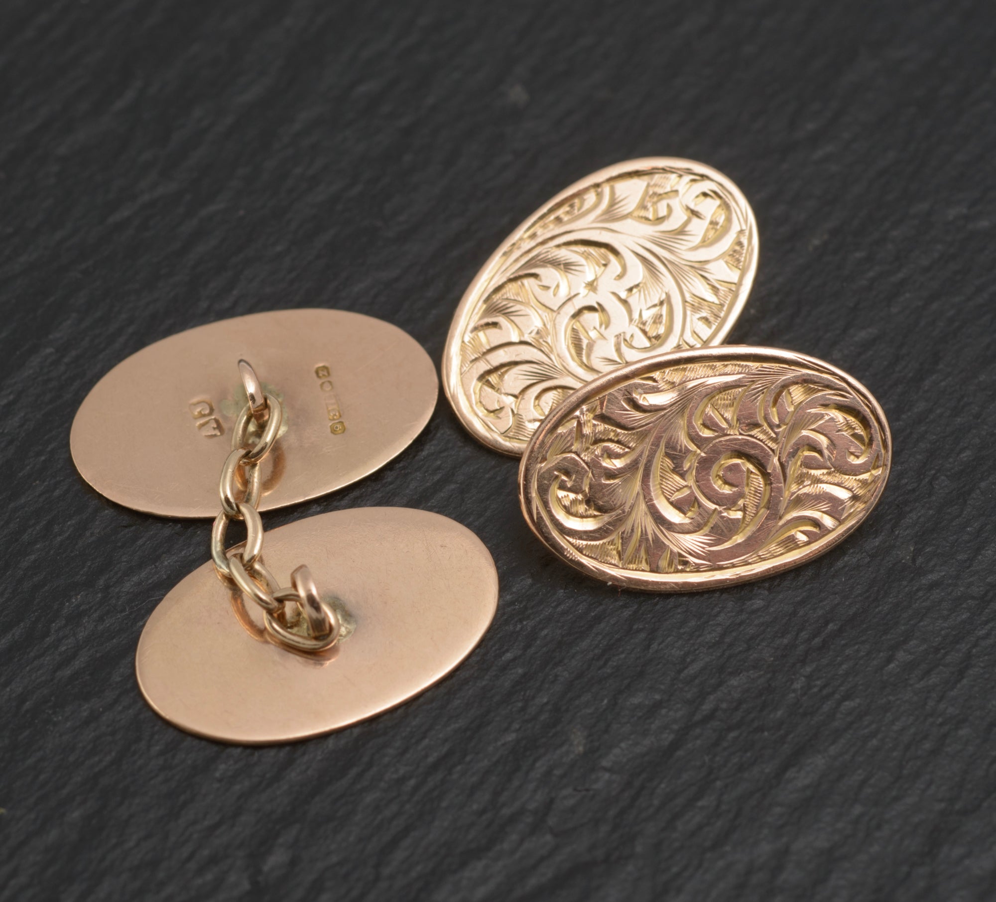 Antique 9ct light rose gold cufflinks - engraved foliate scrolls - rear view showing plain reverse oval panels with chain link fittings and Birmingham hallmarks struck to reverse
