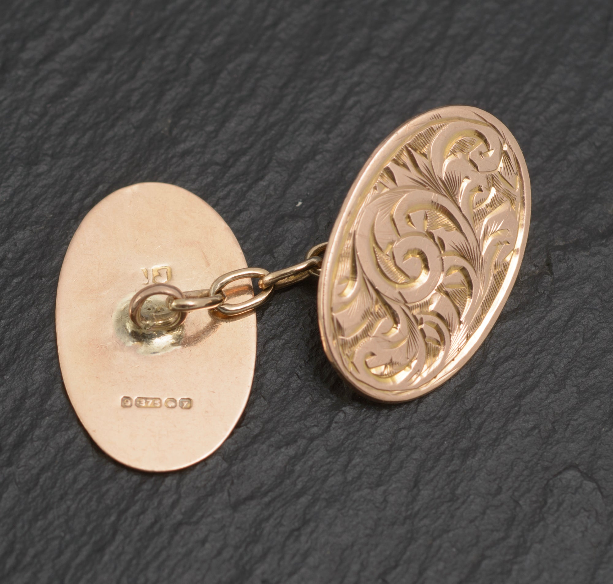 Antique 9ct light rose gold cufflinks - engraved foliate scrolls - hallmark detail showing full Birmingham 9ct gold assay marks dated 1923/24 and maker's mark AJ struck to plain reverse panel