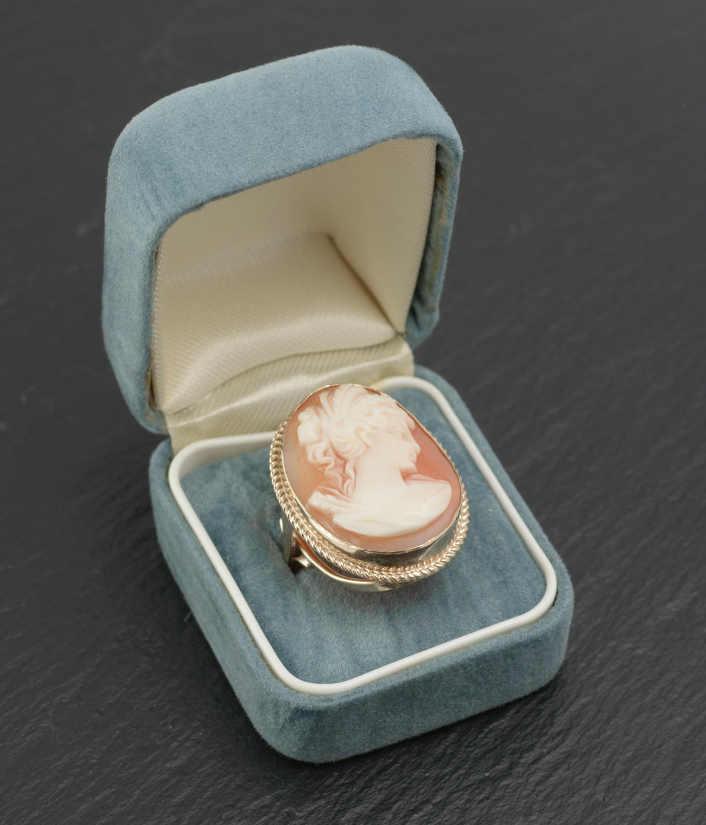 Vintage 9ct gold cameo ring - large carved shell portrait cameo - rear three-quarter view on dark slate showing open gallery of sweeping crossed supports and rope twist bezel border