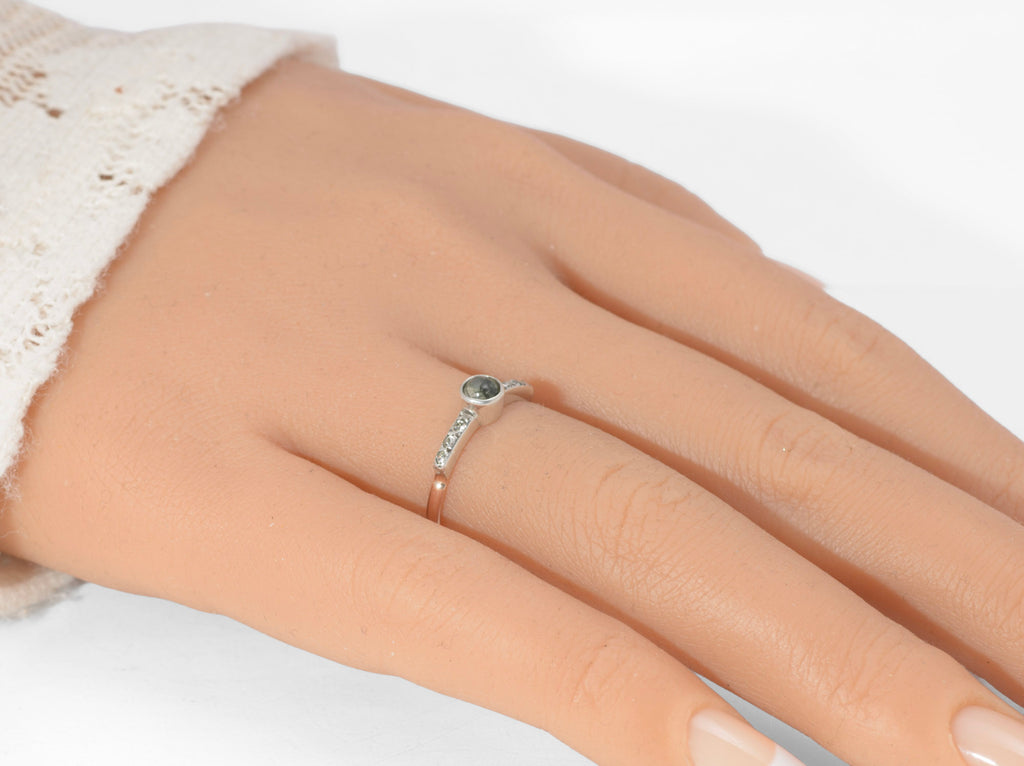 Art Deco moss agate ring - 9ct rose gold and silver - top down view showing round moss agate cabochon with green branching inclusions in plain silver bezel with paste set tapered shoulders