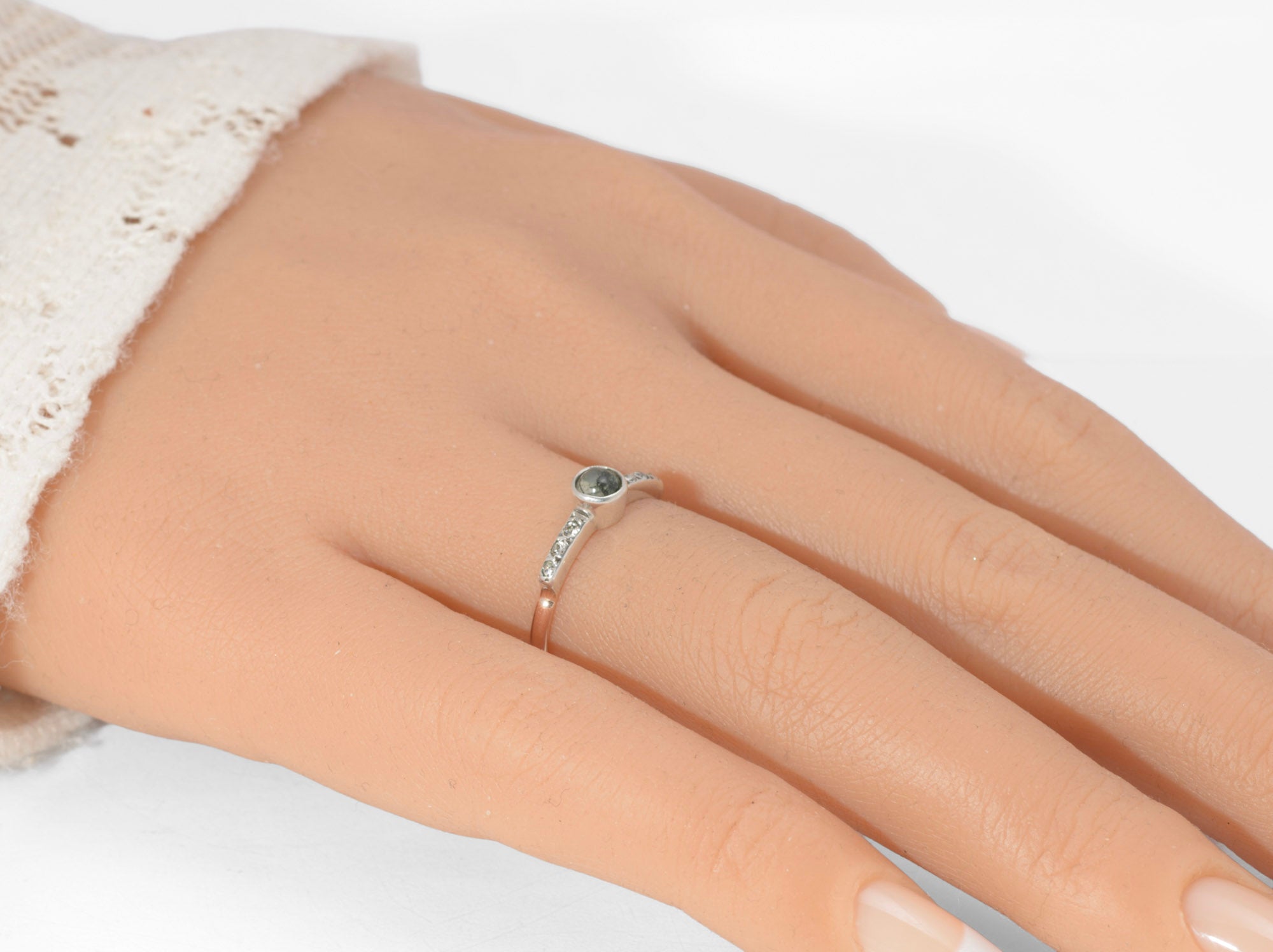 Art Deco moss agate ring - 9ct rose gold and silver - top down view showing round moss agate cabochon with green branching inclusions in plain silver bezel with paste set tapered shoulders