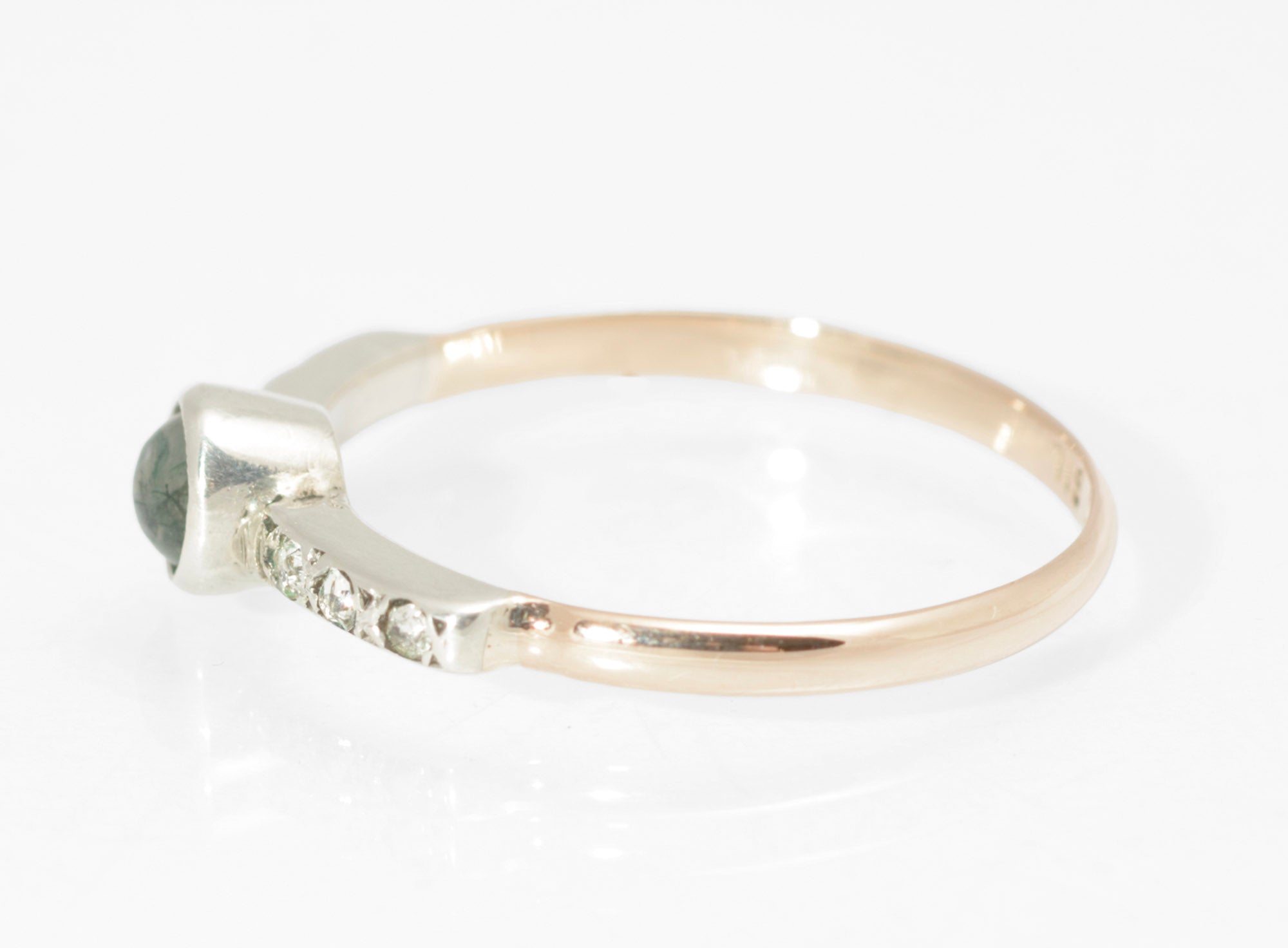Art Deco moss agate ring - 9ct rose gold and silver - worn on hand showing scale of delicate ring with moss agate centre and paste shoulders on rose gold band