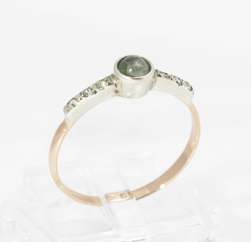 Art Deco moss agate ring - 9ct rose gold and silver - three-quarter front view showing full ring with moss agate centre, paste shoulders and transition from silver head to rose gold band