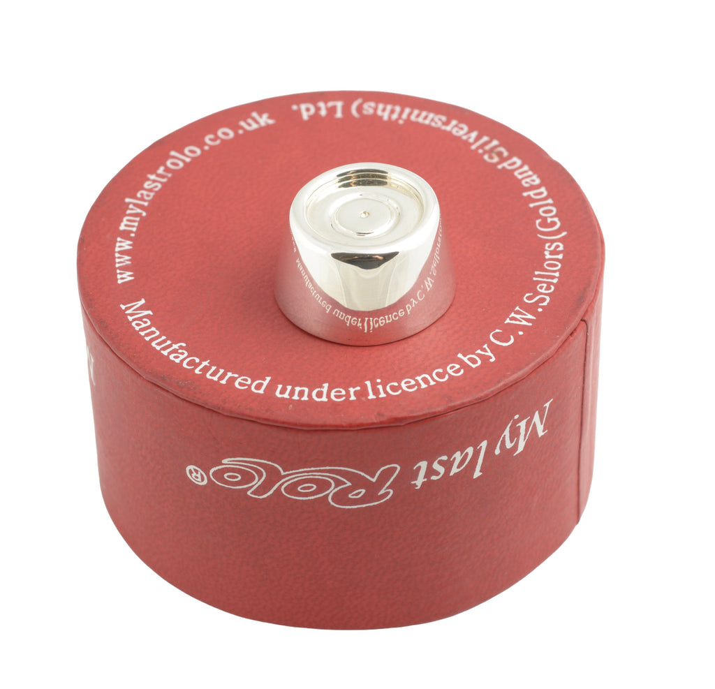 Sterling silver My Last Rolo keepsake - Sheffield 2005 - C. W. Sellors - three-quarter view of red cylindrical presentation box with lid open and polka dot ribbon bow showing My Last Rolo branding on white background