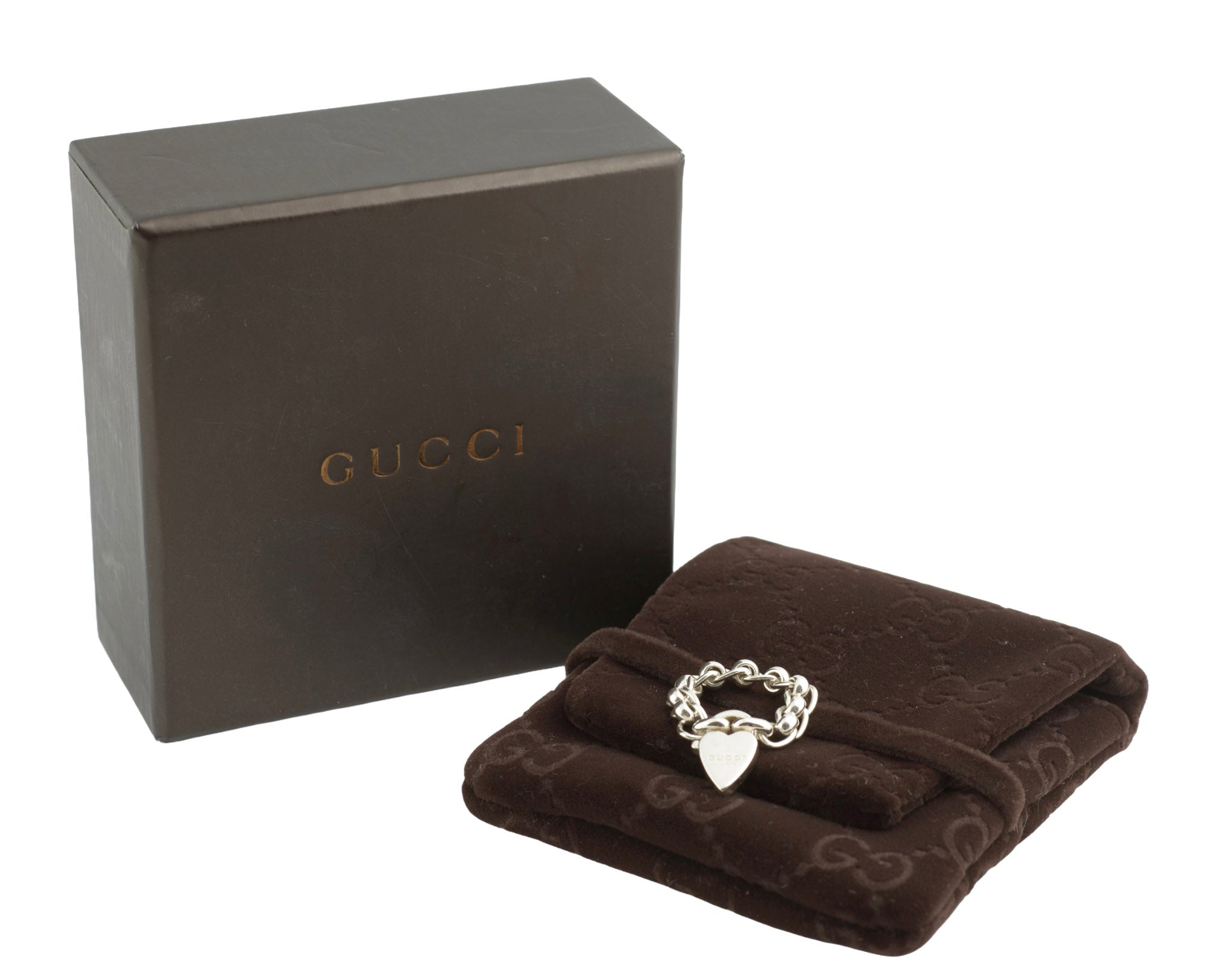 Gucci sterling silver chain link ring with heart charm - ring displayed on GG monogram soft brown pouch alongside original dark chocolate brown Gucci presentation box on white background
