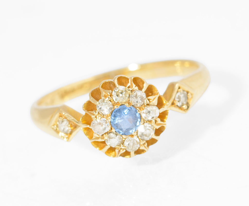 Antique 18ct gold sapphire and diamond cluster ring - front view showing sapphire centre and diamond halo