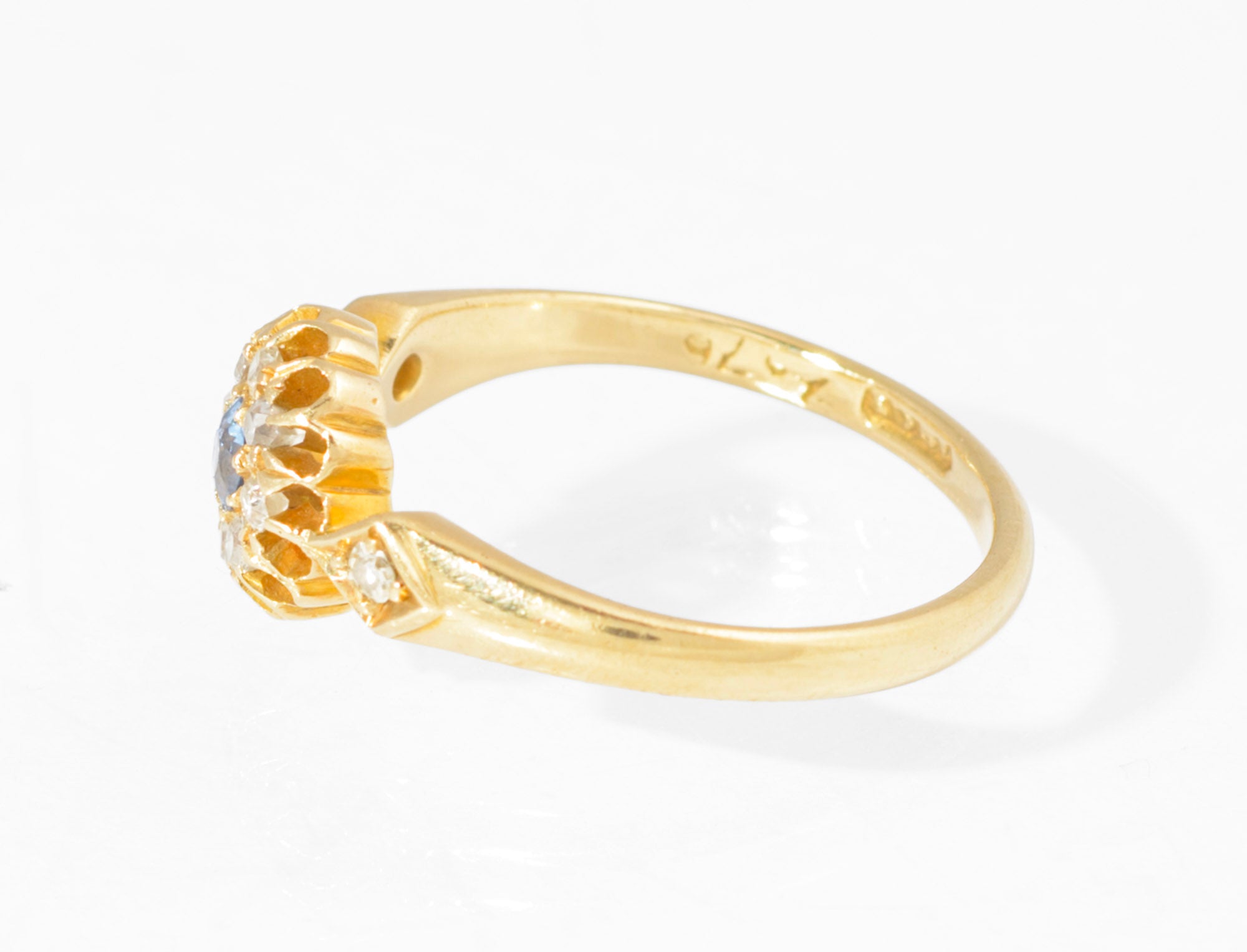 Antique 18ct gold sapphire and diamond cluster ring - angled view showing depth of buttercup setting