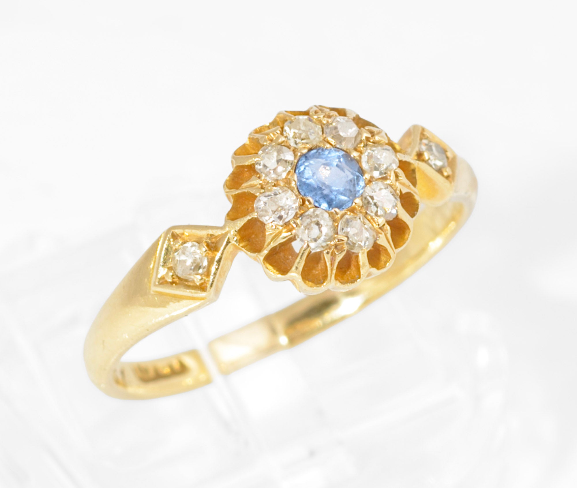 Antique 18ct gold sapphire and diamond cluster ring - worn on hand model showing scale and fit