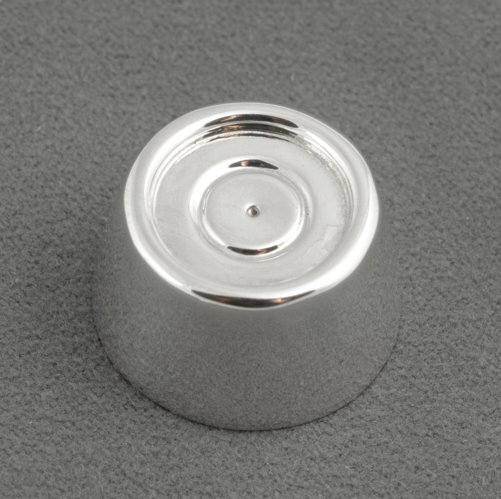 Sterling silver My Last Rolo keepsake - Sheffield 2003 - C. W. Sellors - angled top view on grey background showing tapered cylindrical form with recessed circular top concentric ring detail and high polish finish to sides