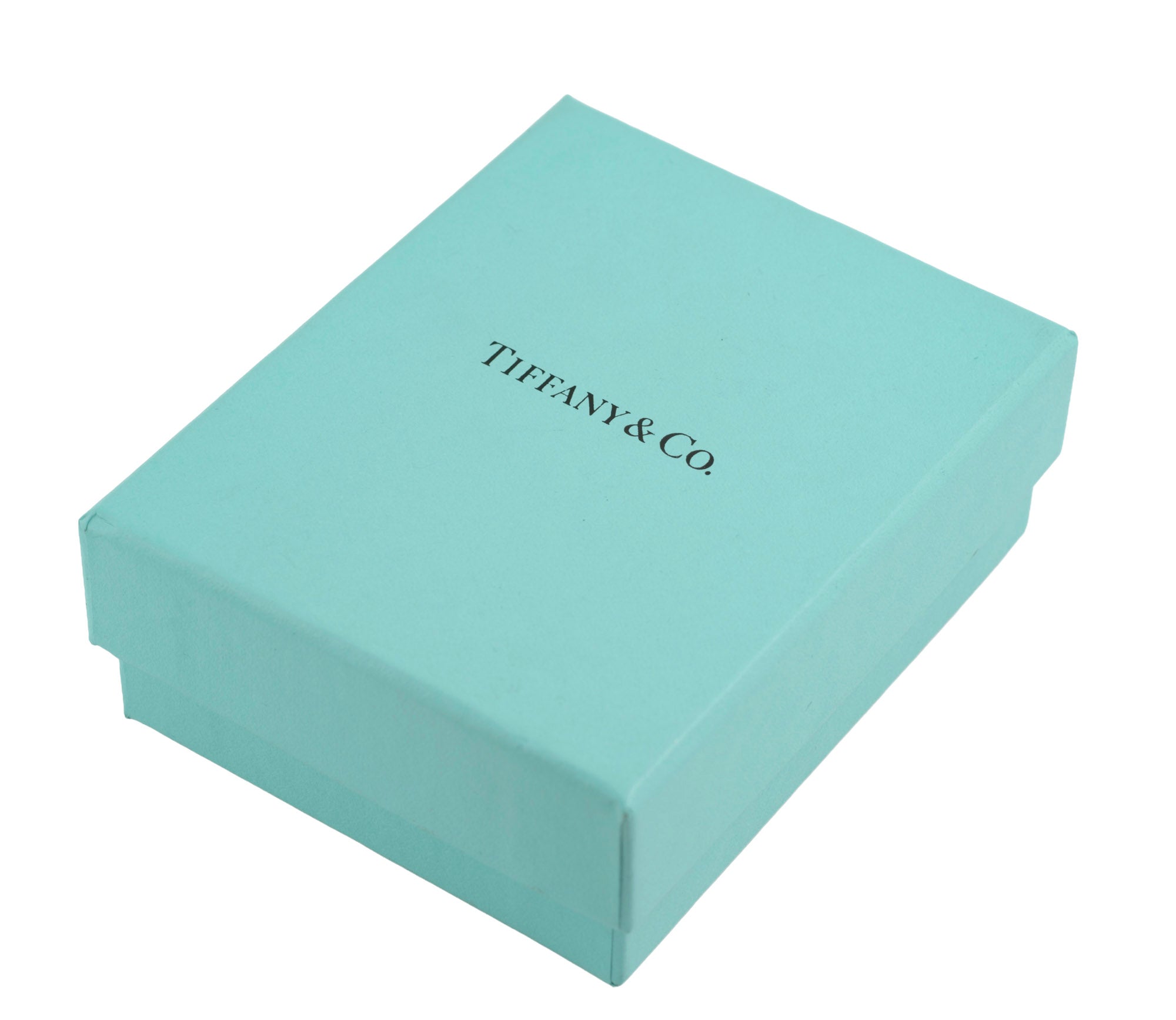 Tiffany and Co blue presentation box closed on white background showing Tiffany and Co name printed to lid in dark green