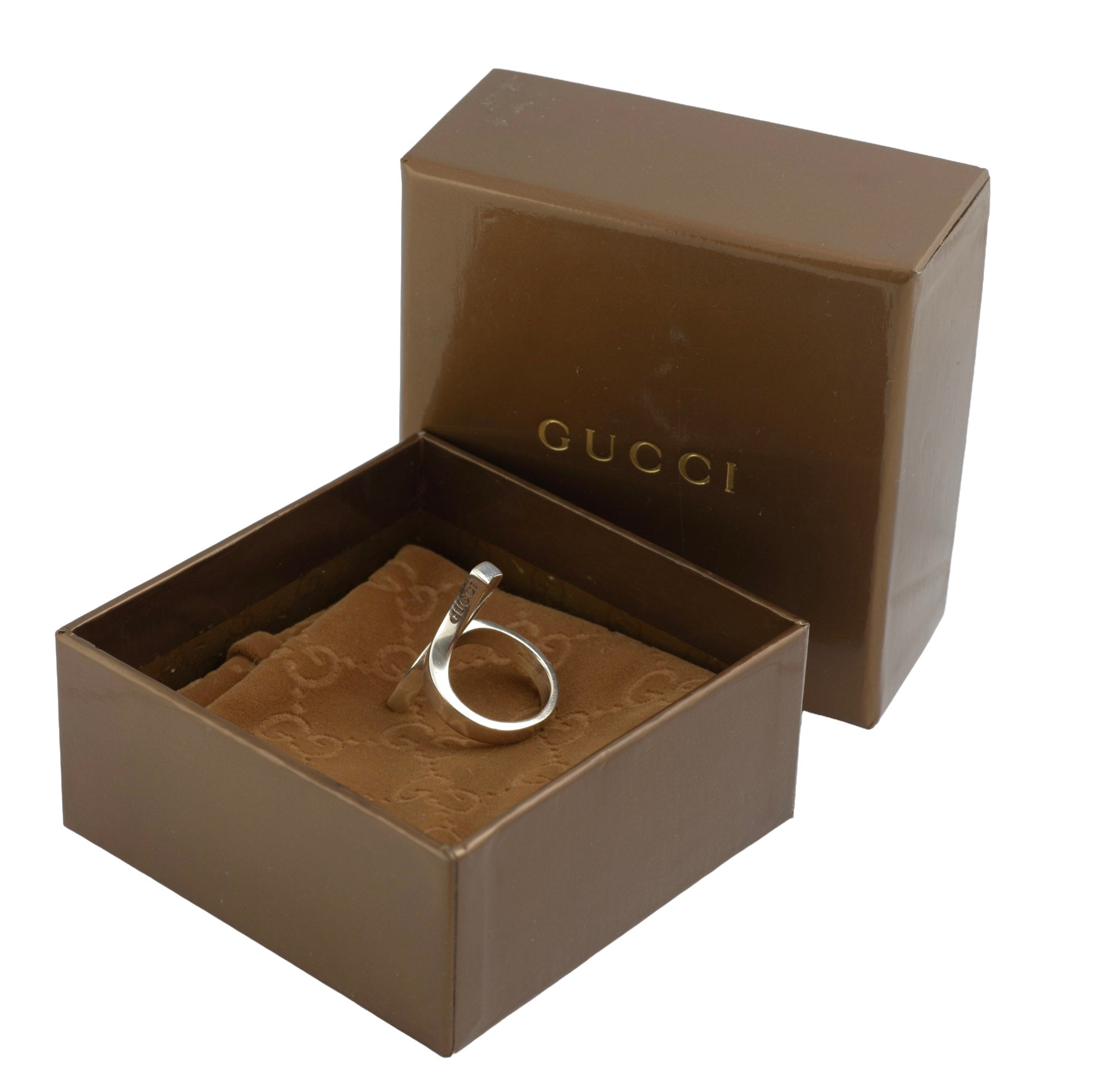 Vintage Gucci Chiodo sterling silver crossover bar ring on Gucci GG monogram pouch showing Gucci engraved to upper face of crossover bar and London and Italian hallmarks to inner band