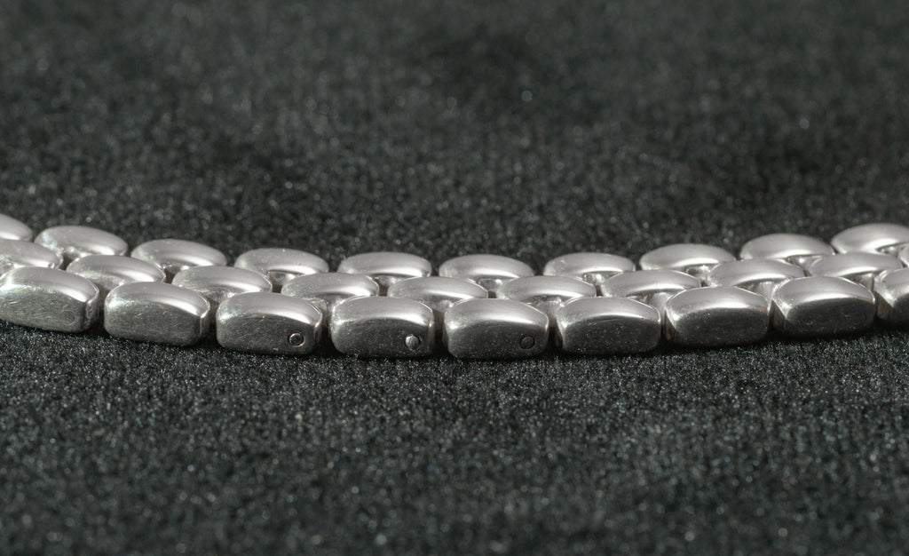 Close up of heavy sterling silver three row brick link necklace end fitting on black background showing 925 hallmark stamp and SC pictorial device SC maker's mark