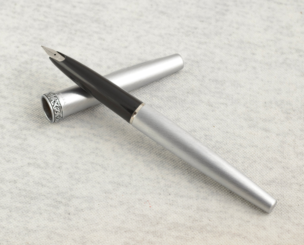 Lady Sheaffer 620 Florentine mechanical pencil assembled on linen background showing full length of brushed silver tone pencil with acanthus scrollwork Florentine band and pocket clip with white dot