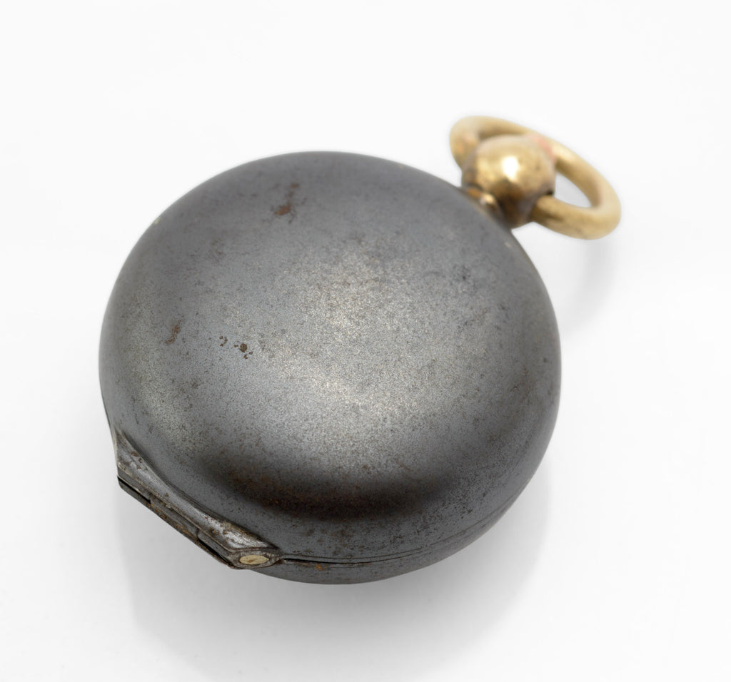 Antique gun metal sovereign case open showing spring loaded coin pusher with concentric guilloche engine turned face and curved brass retaining sections on white background